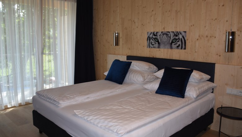 double bed themed room tiger, © Helmut Leonhartsberger double bed themed room tiger, © Helmut Leonhartsberger