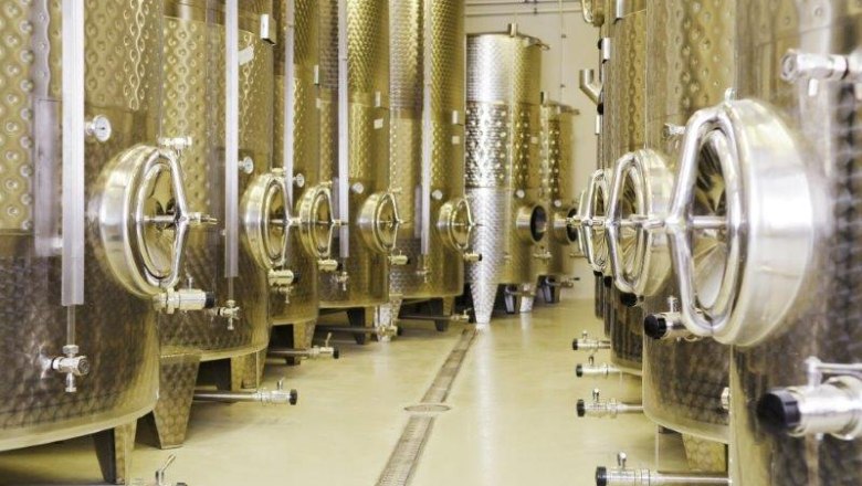 Wine cellar Haimel Winery, © Weingut Haimel Modern wine barrels side by side.