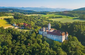Schallaburg Renaissance Castle, © Alexander Kaufmann Aerial view of Schallaburg in the middle of a green landscape.
