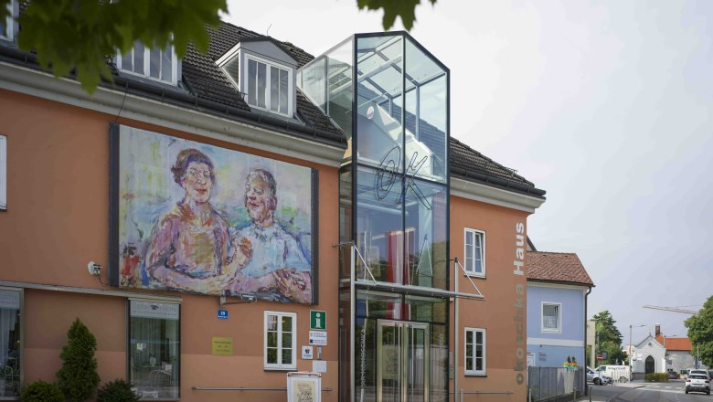Exterior view of the Oskar Kokoschka House with large painting on the façade.