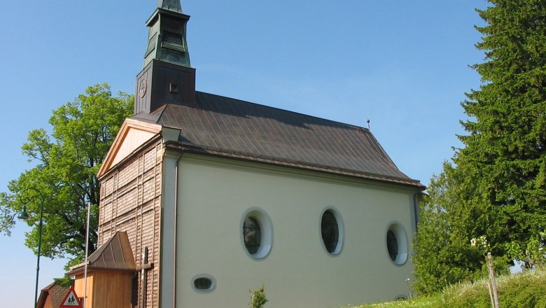 St. Anne's Church in Puchenstuben with green surroundings and blue sky.